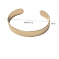 Detail view of gold hammer textured bangle with 68mm diameter and 17.2g weight - Hammered Bangle