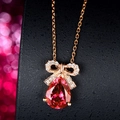 Rose gold necklace with a red pear-shaped gemstone and sparkling diamond bow pendant - Rose Gold Bow Necklace Xl-116 [with Cross Chain]