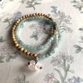 Double-layer wood and green stone bead bracelet set on a vintage floral tablecloth - Bracelet - Brown and Green