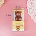 Brown teddy bear birthday candle in transparent packaging for creative cake decoration - Bowtie Bear Candle