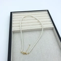 Detail view of round white pearl necklace with adjustable 14k gold plated clasp - 18K Gold Plated 3mm (38+4cm)