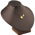 Detail view of a gold stainless steel necklace with three layered circular metal pendants - Gold (Large Disc + 2 Small Discs)