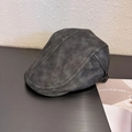Detail view of the vintage faux leather texture and buckle on this dark ivy cap - M (56-59cm) / Gray