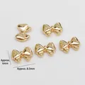Detailed view of 5pcs gold bow nail art charms made of alloy for DIY jewelry decor - Polished Bow Style (2#)