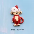 Detail shot of a red monkey resin patch with high gloss finish and 2.3x4cm size guide - Mr. Monkey