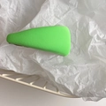 Detail of vibrant green textured hair clip resting on white decorative tissue paper - Light Green