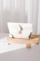 Detailed close-up of tulip floral embroidery on textured seersucker cosmetic pouch - Tulip Large / Large