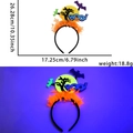 Neon Halloween headband featuring orange fringe and Boo! bat moon ornaments in UV light - One Size / Moon and Dead Tree Style
