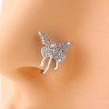 Macro shot of silver butterfly nose clip with clear rhinestones on model's nose - Silver