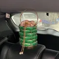 Detail of emerald green rhinestone bucket bag with gold ring handle and pearl drawstring - Green