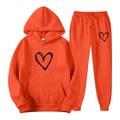 Bright orange tracksuit set with hooded sweatshirt and pants featuring black heart print - S / Orange