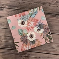 Floral paper napkin with vintage anemone and protea print on a rustic wood background - Pink Background Floral