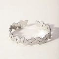 Macro detail of silver-colored butterfly-shaped textured metal links on an open bangle - Silver Butterfly Style (6-DQ-001)