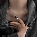 Elegant silver crescent moon pendant necklace worn on a black denim outfit for women - Silver Crescent Moon Style (XL2635)