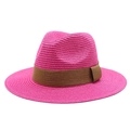 Close-up of a rose red straw Panama hat with fine weave texture and brown band - Rose Red