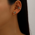 Golden hummingbird ear cuff set with blue zircon and long tassel on female model - Blue Hummingbird Ear Clip and Threader Set
