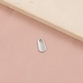 Macro shot of S925 sterling silver teardrop charm with engraved hallmark on a stone - Teardrop S925 Tag (3#) / Steel
