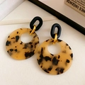Close-up of leopard resin hoop earrings with black matte link and gold metal detail - 36# Tortoise Hollow Double Round