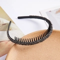 Close-up of black non-slip headband with sparkling rhinestones and inner comb teeth detail - Gray