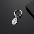 Vintage stainless steel earring with hanging oval religious pendant on black surface - Religious Relief