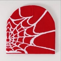 Detailed close-up showing the red and white spider web jacquard knit pattern on the beanie - Red with White Web