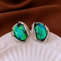 Macro shot of vintage silver earrings with green resin stone and sparkling rhinestones - Silver Earring Post - Silver - Green