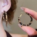 Macro detail of retro C-shaped earrings featuring leopard print leather texture and gold clasp - 9# Hoop - Brown - 3mm