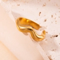 Adjustable gold wave ring with hollow star design on a rustic stone background - Simple Wave