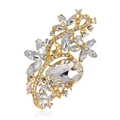 Detailed macro view of a golden crystal floral brooch with pear-shaped center stone - Transparent (Gold Base)