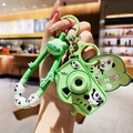 Portachiavi fotocamera panda verde con proiezione LED e cinturino da polso - Panda Sdraiato Fotocamera