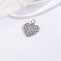 Macro shot of silver heart pendant with woven texture and micro-pave clear gemstones - Lattice Texture Zircon Heart Pendant / Silver