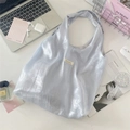 Vista dettagliata della borsa tote metallizzata blu argento con accessori stile di vita - Azzurro