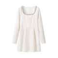 Detail of elegant white velvet dress featuring exquisite hand-beaded rhinestone neckline - White