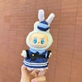 Blue sailor suit and hat plush outfit set for Labubu doll, shown in hand closeup - Rabbit Officer Pendant / First And Second Generation Keychains Are Compatible With La Cloth Dolls. Dolls Not Included.