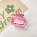 Detail of pink matte square hair claw clip with rectangular cutout and inner teeth - Matte Small Square Pink