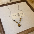 Vintage stainless steel necklace featuring tiger eye stones on a wooden display tray - 12# Tiger Eye Pendant Necklace