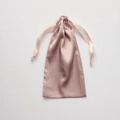 Pink silk texture drawstring bag with smooth glossy finish on white background - Champagne Pink