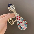 Elegant gold pipa-shaped hair claw clip with colorful enamel flowers and tiny rhinestones - Pipa Shape Enamel Color Claw