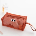 Cute orange mesh makeup bag with cartoon eyes and a zipper closure handle - Small / Orange