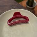 Close-up of elegant dark red resin hair claw clip in a ceramic dish, 10cm perfume bottle style - China Red