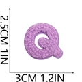 Macro shot of purple chenille letter Q patch with precise height and width measurements - Letter-Q