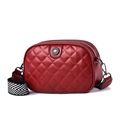 Red quilted crossbody bag with multiple zip compartments and wide patterned strap - Burgundy