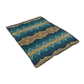 Detail shot of navy blue tribal flannel blanket with orange geometric patterns and lockstitch - Dark Teal Southwest Geometric