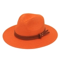 Close-up of orange straw panama hat featuring a dark brown leather band with metal rivets - Orange