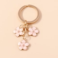 Portachiavi con fiori di ciliegio in smalto rosa e anello dorato per borse - Rosa