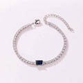 Elegant silver tennis bracelet with blue rectangular center stone and white cubic zirconia. - Rectangular Style (Blue Rhinestone) / White Gold