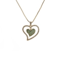 Detail of gold double heart pendant necklace with green and white cubic zirconia - Double Heart Green Zirconia