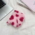 Macro detail of plush pink coin purse featuring red hearts and high-quality zipper closure - Pink Heart Style