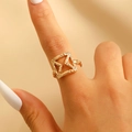 Macro view of golden geometric square ring with textured envelope design on finger - Square Geometric Frame Hammered Ring (0269) / Gold