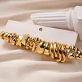Set moderno da 10 paia di orecchini a cerchio dorati con vari design geometrici - Set da 20 pezzi Oro
